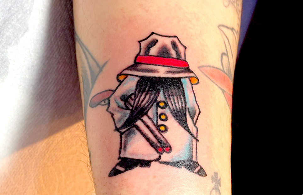 Picture, of a tattoo by Troy, tattoo artist at Top Hat Tattoo, Seattle, man with hat cover head, large mustache poking out, wearing trench coat and holding a shotgun