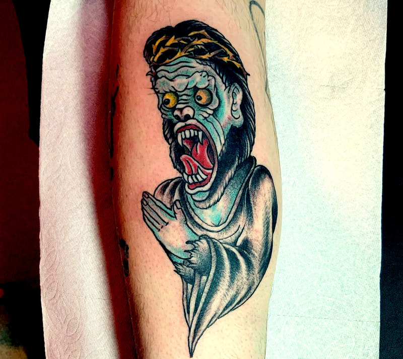Picture, a tattoo by Agus, owner of Top Hat Tattoo, Seattle, baboon zombie jesus character