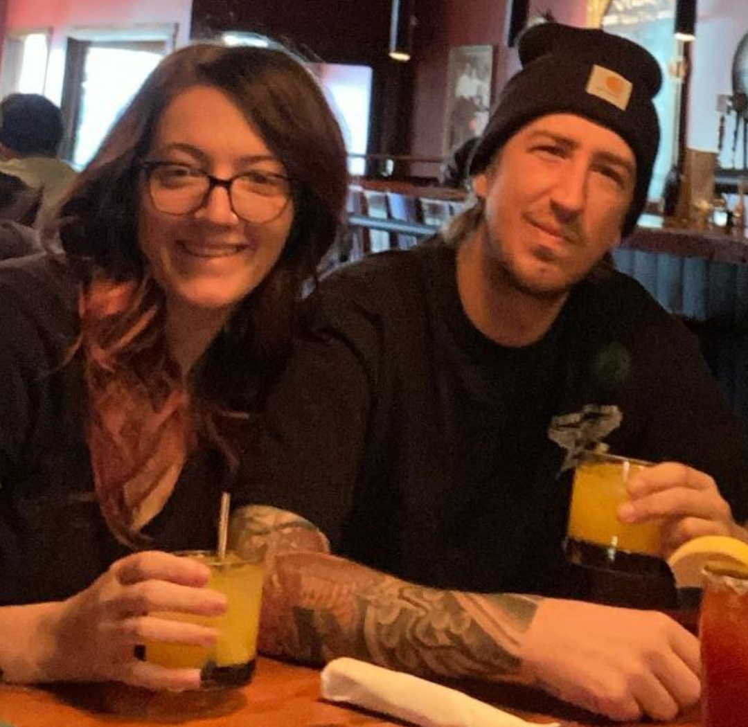 Picture, of Troy, tattoo artist at Top Hat Tattoo, Seattle, having a drink with his girlfriend